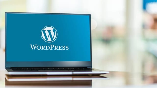 WordPress logo on laptop screen