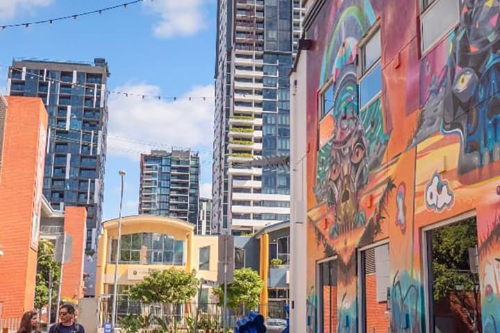 Melbourne street with colorful mural and modern buildings