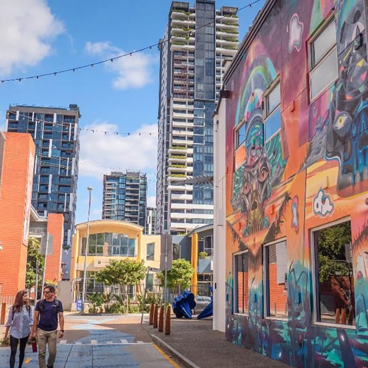 Melbourne street with colorful mural and modern buildings