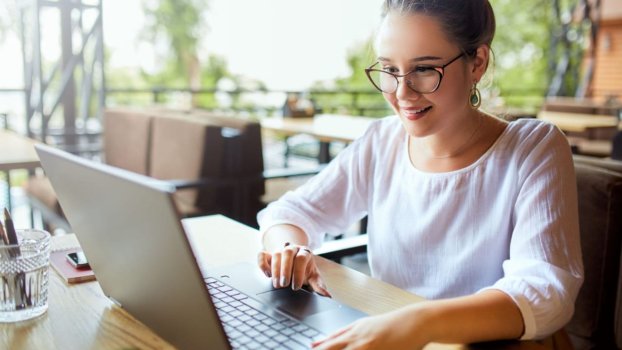 woman working on computer in a cafe