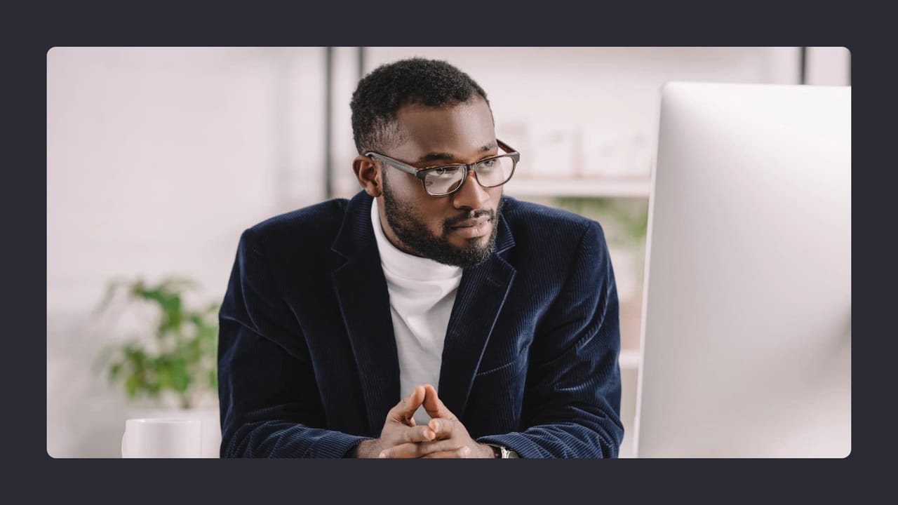 Focused businessman with glasses in office setting