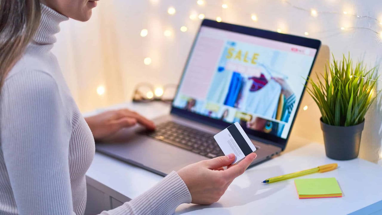 Online shopping with credit card on laptop