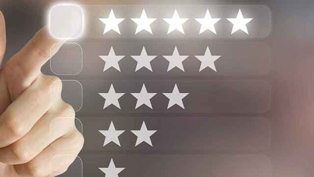 Business hand clicking customer reviews on virtual screen interface