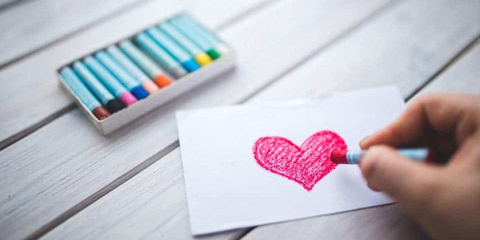 drawing red heart with crayons