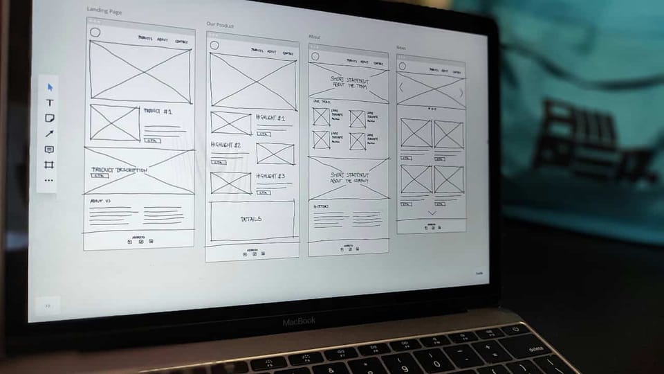 Laptop displaying website wireframe design