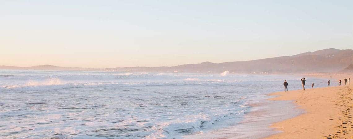 Beach coastline with reddish brown sand