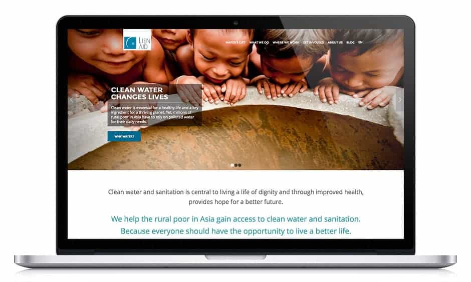 Lien Aid website displayed in MacBook laptop screen