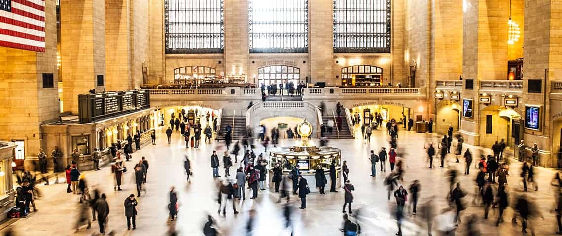 Adding-Functionality-to-WordPress-with-Plugins-Featured American train station with a crowds of people inside