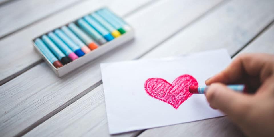 drawing red heart with crayons