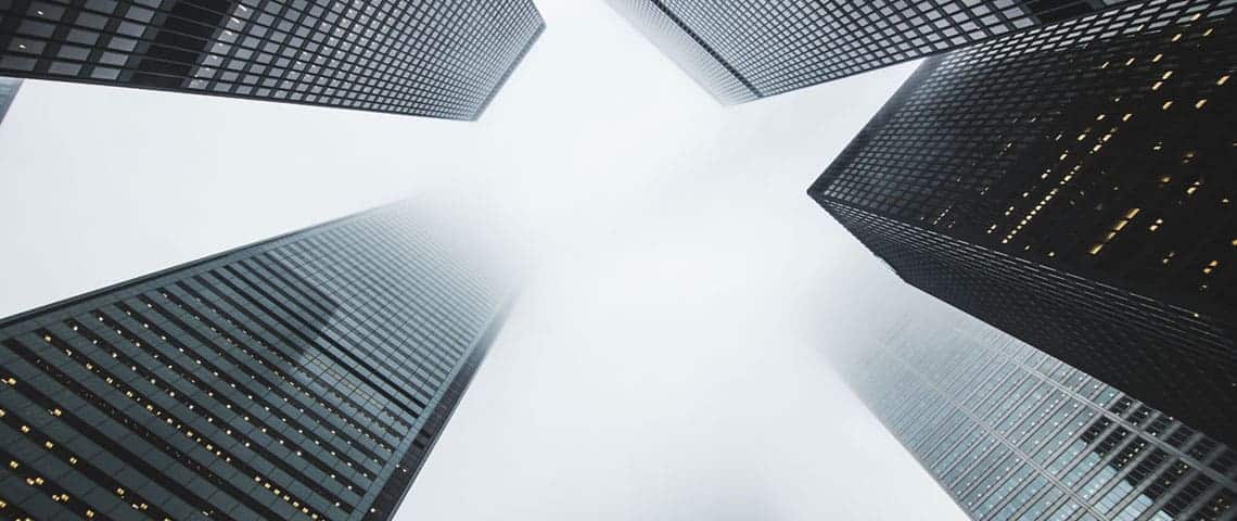 Ultra wide, black and white photo of business district buildings