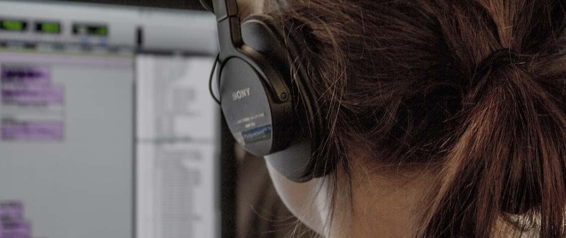 How to Manually Upgrade Your WordPress Website-featureimage1 Someone listening on headphones while following our guide to upgrade wordpress