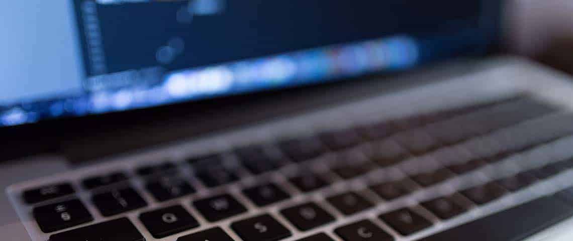 How Does a Blog Generate Traffic-featured image Macro photograph of laptop keyboard with blur effect