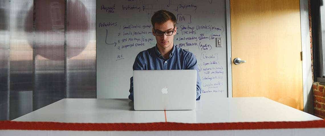 A man using his computer before launch to test his market