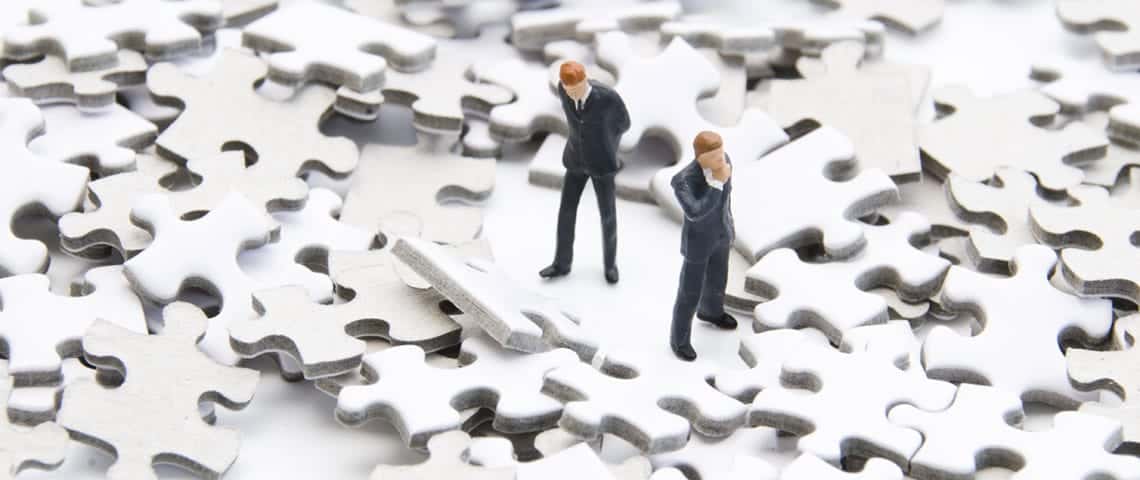 3-Ways-Your-Website-Is-Losing-Customers-Featured 2 figurine men searching for something on the puzzle pieces