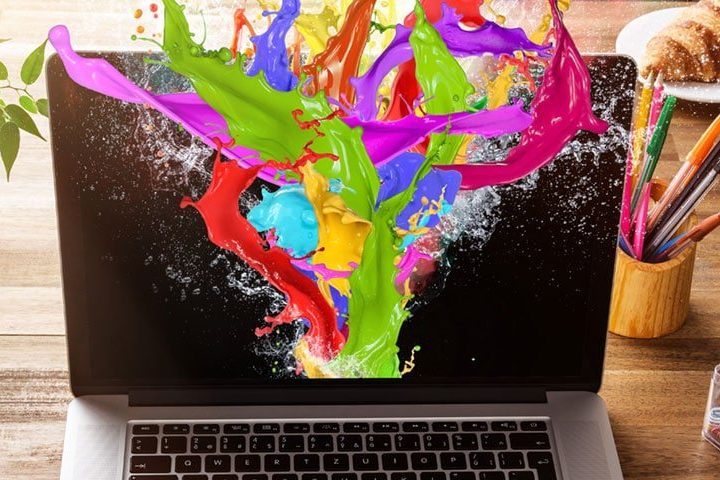 A computer screen awash with paint for the imagery that colours that enhance your website