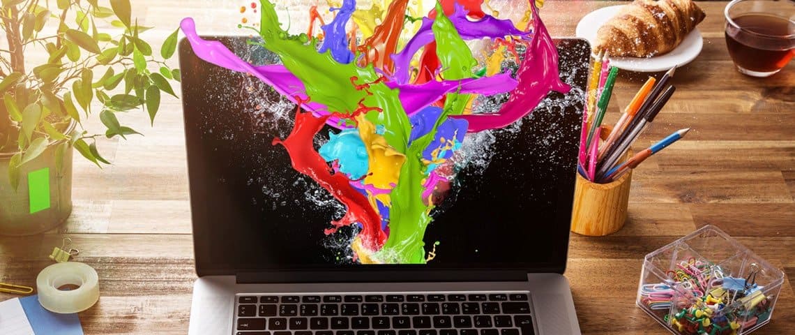 A computer screen awash with paint for the imagery that colours that enhance your website