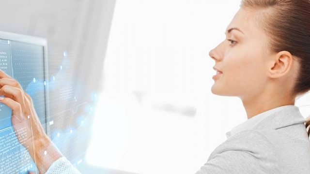 woman using a touch screen monitor