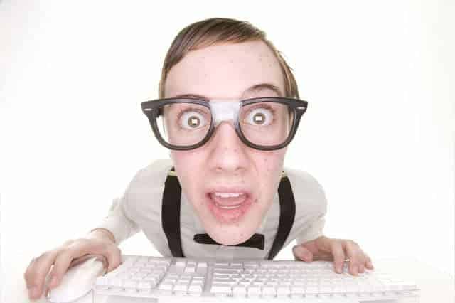 shocked nerdy man on a keyboard