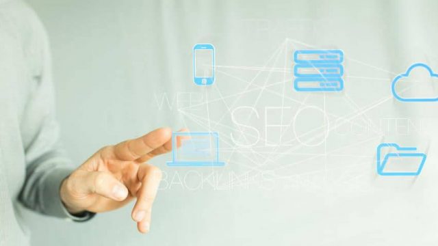 man pointing at website