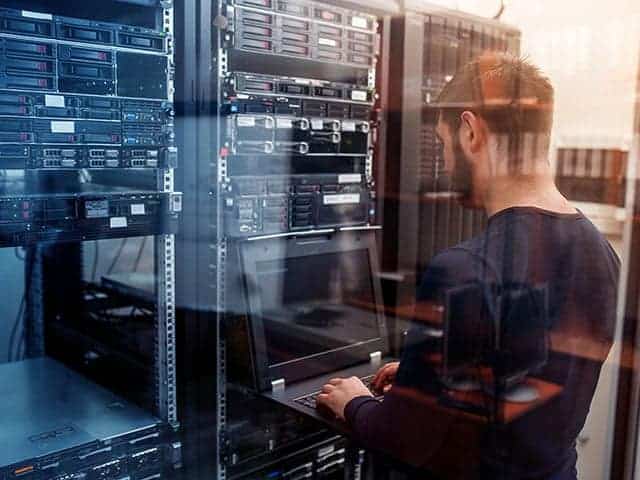 IT specialist doing maintenance on servers