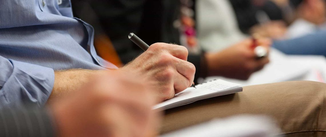 making notes at conference detail
