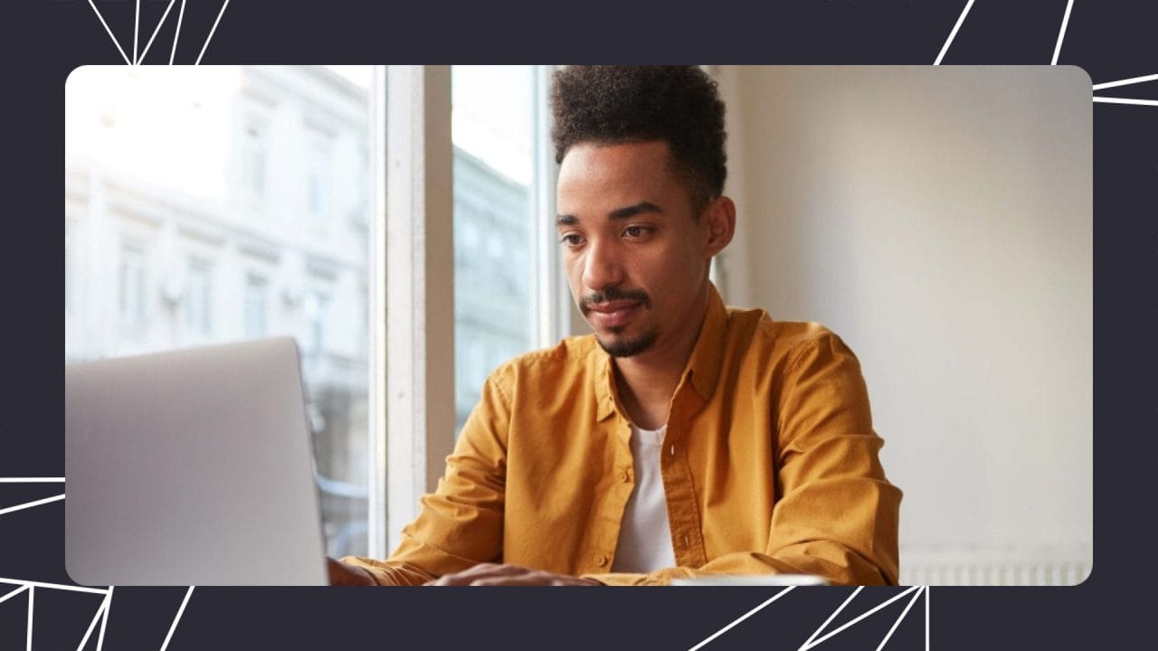 man working on his laptop in an office