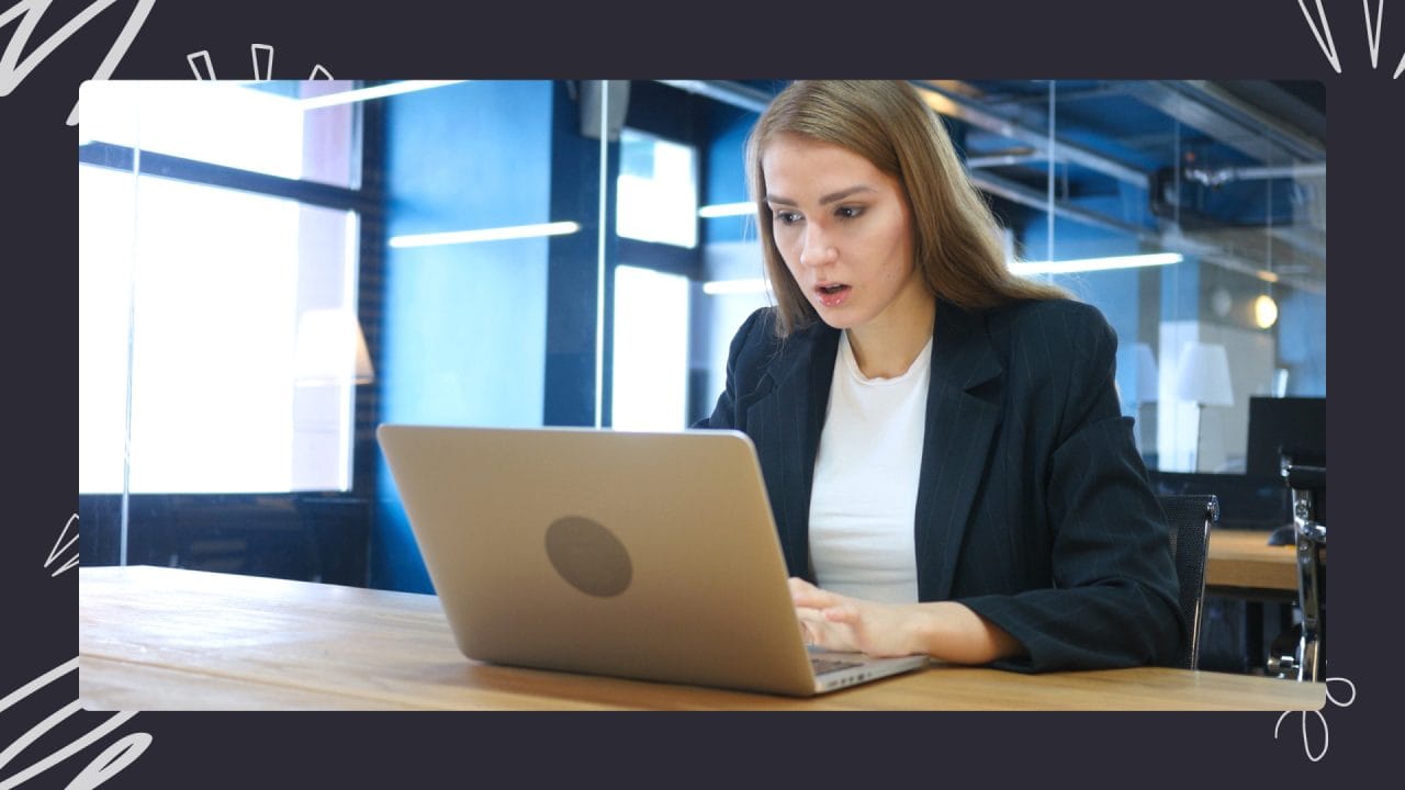 woman working on laptop in a cafe