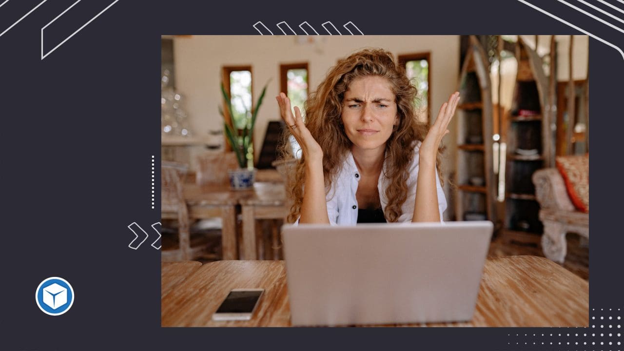 Woman at her laptop showing frustration with the limitations of Weebly