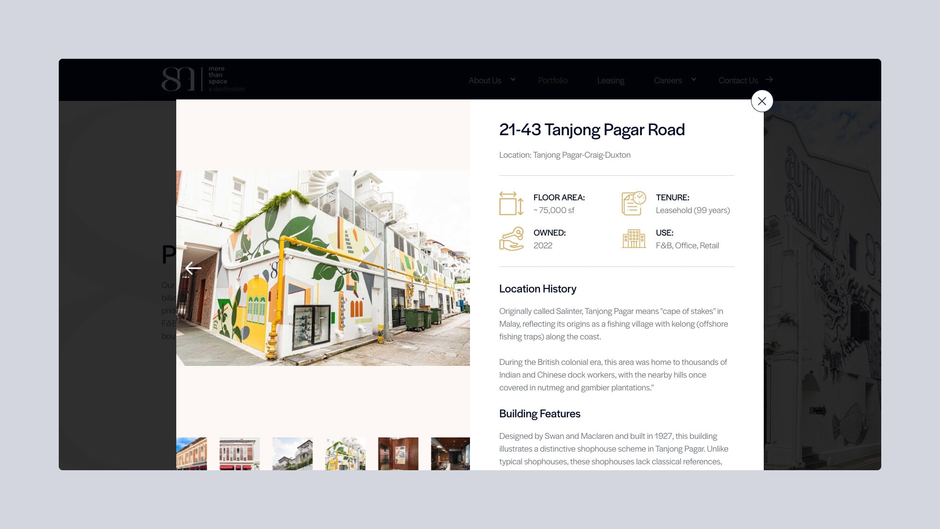 portfolio-8m-real-estate-portfolio Colonial style building with business infographics displayed