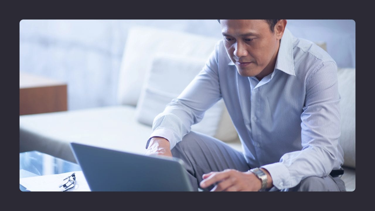 Businessman working on laptop in modern office