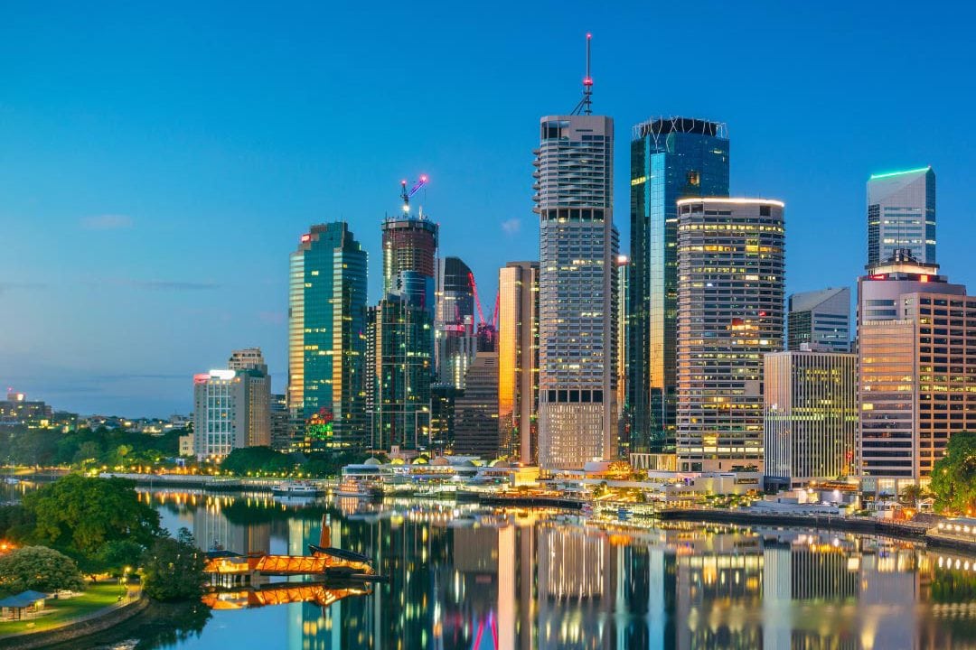 Twilight over Brisbane skyline with reflective river