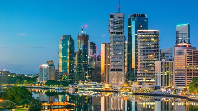 Twilight over Brisbane skyline with reflective river