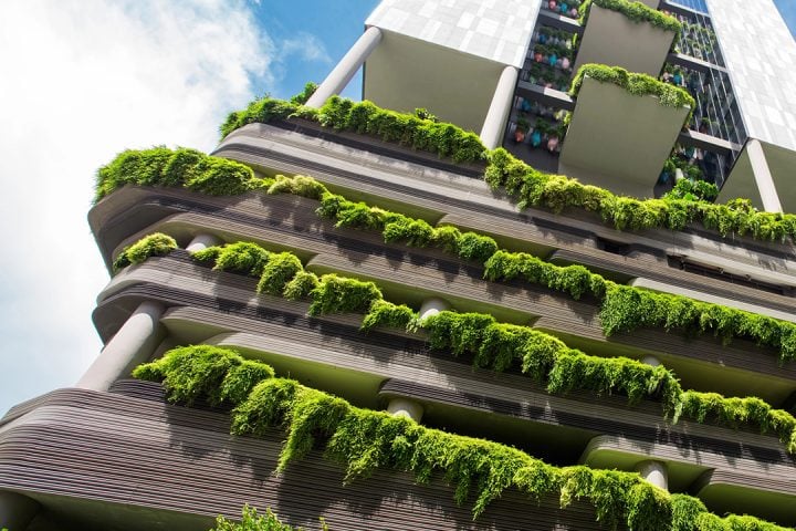 Eco-friendly building with lush green vertical gardens