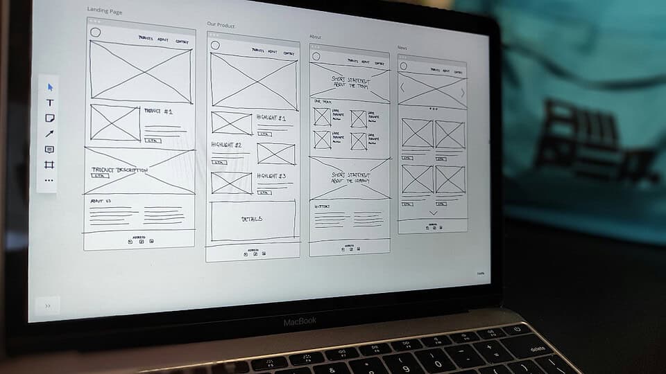 Laptop displaying website wireframe design