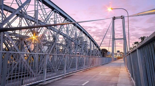 Steel bridge walkway during sunset in Australia.